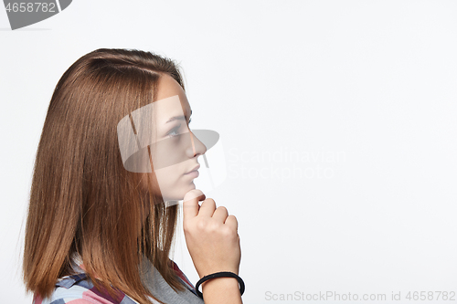 Image of Portrait of smiling teen girl looking at camera