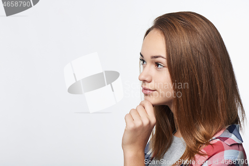 Image of Portrait of smiling teen girl looking at camera