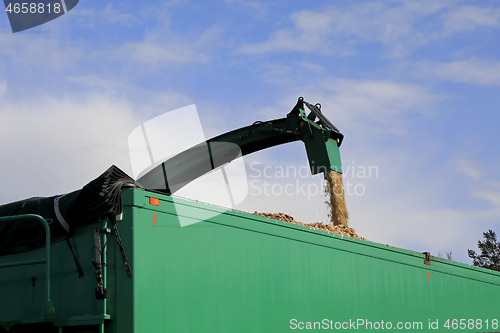 Image of Wood Chipper Loading onto Trailer