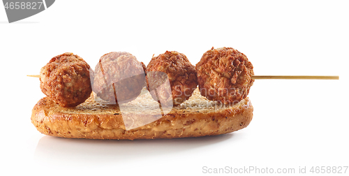 Image of toasted bread with meat balls