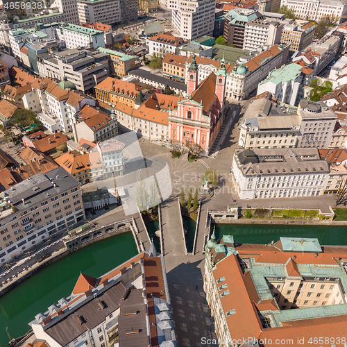 Image of Aerial drone view of Preseren Squere and Triple Bridge over Ljubljanica river,Tromostovje, Ljubljana, Slovenia. Empty streets during corona virus pandemic social distancing measures