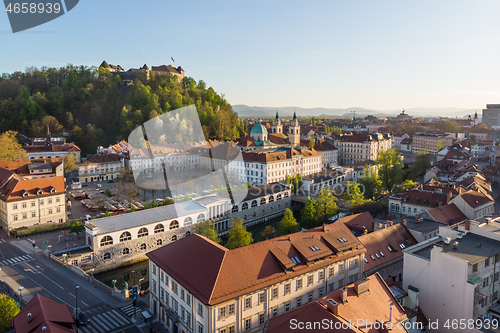 Image of Aerial drone panoramic view of Ljubljana medieval city center, capital of Slovenia in warm afternoon sun. Empty streets during corona virus pandemic social distancing measures