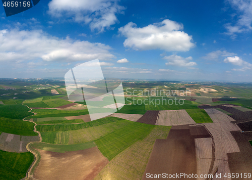 Image of Aerial view of hilly agricultural fields