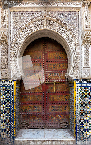 Image of Traditional entrance gate with door in Fes