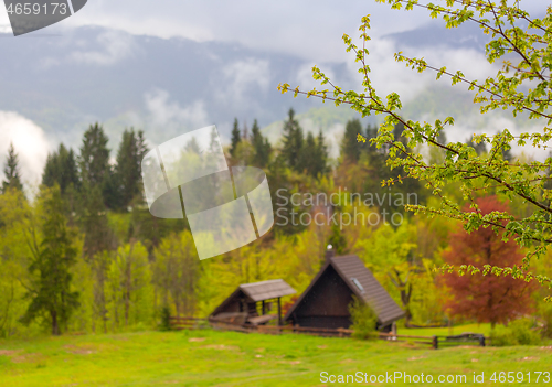 Image of mountain and house in alps at spring