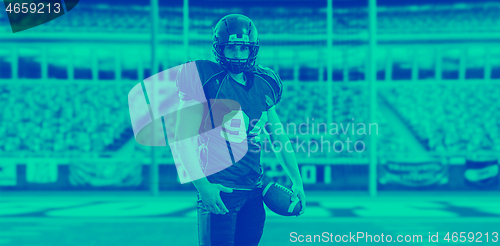 Image of American Football Player isolated on big modern stadium field