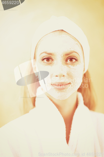 Image of woman in spa  with cosmetic mask