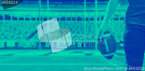 Image of closeup American Football Player isolated on big modern stadium