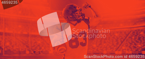 Image of american football player celebrating touchdown