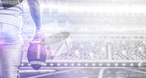 Image of closeup American Football Player isolated on big modern stadium