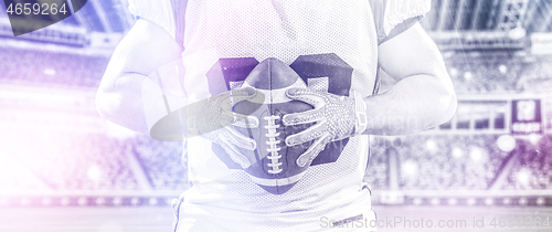 Image of closeup American Football Player isolated on big modern stadium