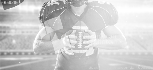 Image of American Football Player isolated on big modern stadium field