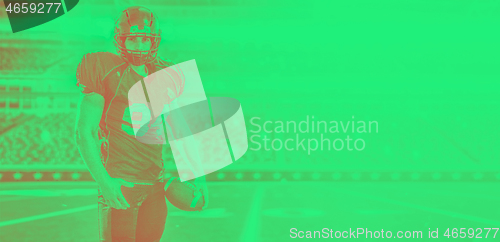 Image of American Football Player isolated on big modern stadium field