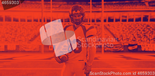 Image of American Football Player isolated on big modern stadium field