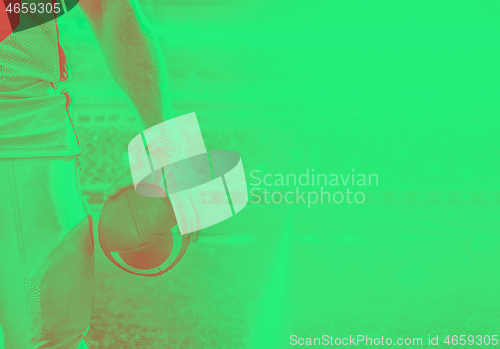 Image of closeup American Football Player isolated on big modern stadium