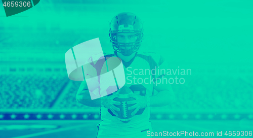 Image of American Football Player isolated on big modern stadium field