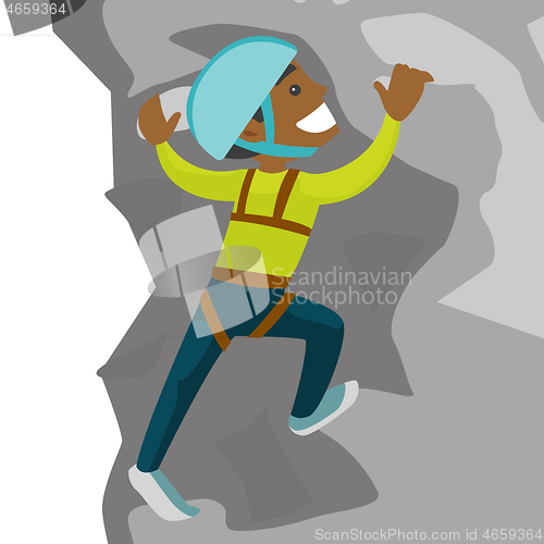 Image of Young black man climbing on a rock.