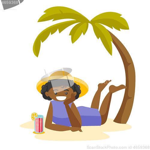 Image of African woman lying on the beach under the palm.