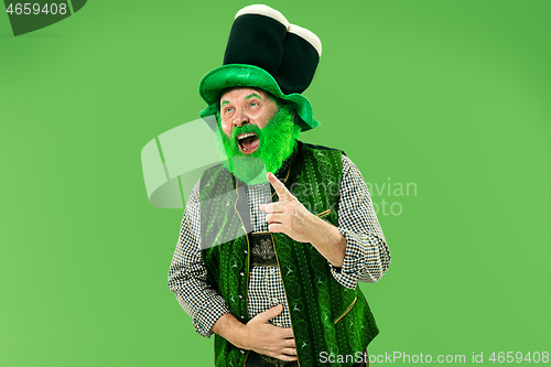 Image of A man in a leprechaun hat at studio. He celebrates St. Patrick\'s Day.