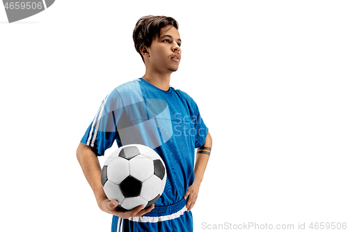 Image of Young fit boy with soccer ball standing isolated on white