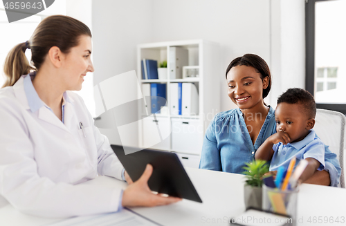 Image of mother with baby and doctor with tablet at clinic