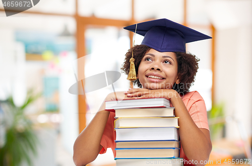 Image of african american graduate student with books