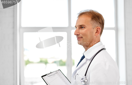 Image of smiling doctor in white coat at hospital