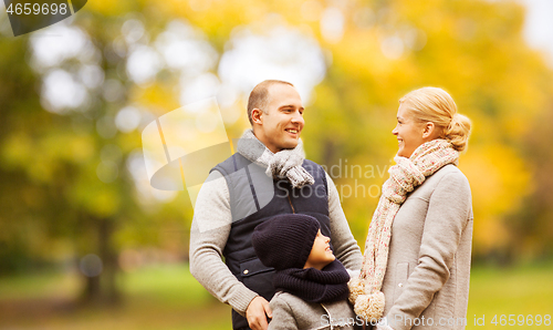 Image of happy family in autumn park