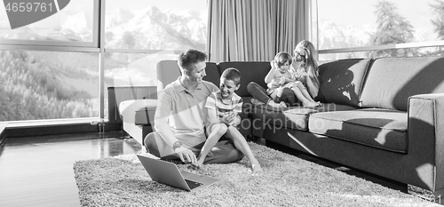 Image of Happy family playing a video game