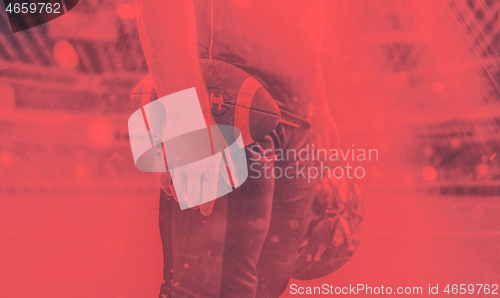 Image of closeup American Football Player isolated on big modern stadium