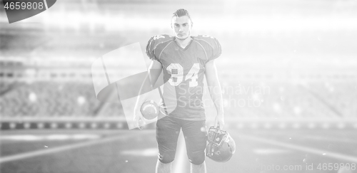 Image of American Football Player isolated on big modern stadium field