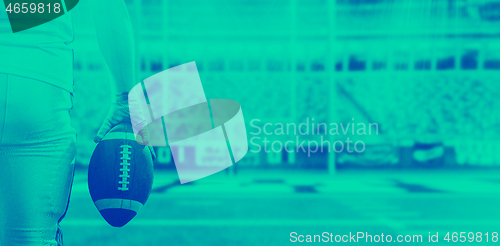 Image of closeup American Football Player isolated on big modern stadium