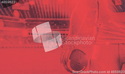 Image of closeup American Football Player isolated on big modern stadium