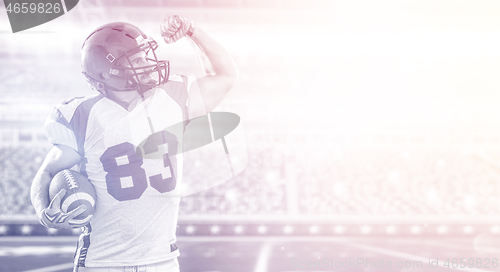 Image of american football player celebrating touchdown