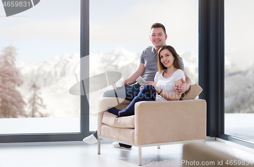 Image of couple using tablet at home