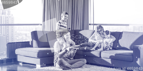 Image of Happy family playing a video game