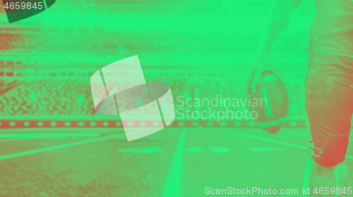 Image of closeup American Football Player isolated on big modern stadium