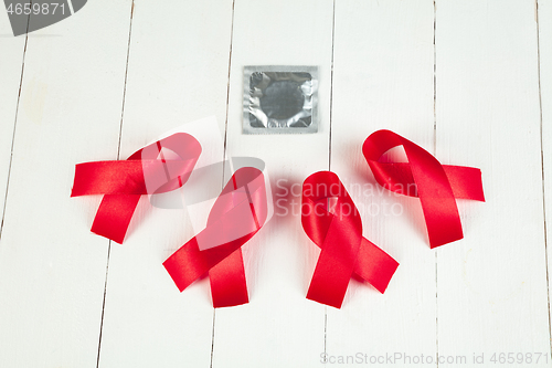 Image of Aids Awareness Sign Red Ribbon. World Aids Day concept.