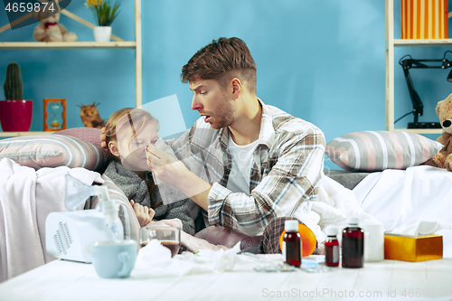 Image of Sick man with daughter at home. The ill family.