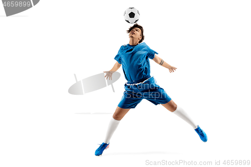 Image of Young boy with soccer ball doing flying kick