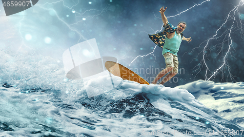 Image of A senior man on a surfboard