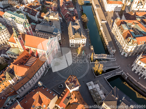 Image of Aerial drone view of Preseren Squere and Triple Bridge over Ljubljanica river,Tromostovje, Ljubljana, Slovenia. Empty streets during corona virus pandemic social distancing measures