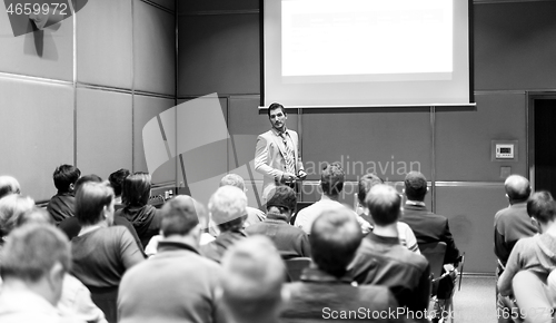 Image of Business speaker giving a talk at business conference meeting event.