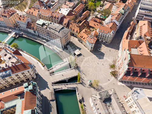 Image of Aerial drone view of Preseren Squere and Triple Bridge over Ljubljanica river,Tromostovje, Ljubljana, Slovenia. Empty streets during corona virus pandemic social distancing measures