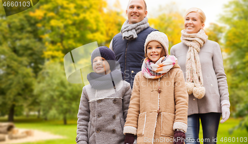 Image of happy family in autumn park