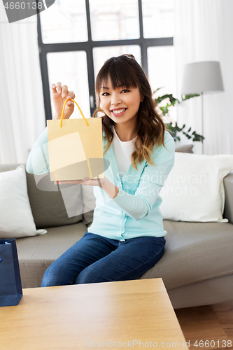 Image of female blogger making video blog about shopping