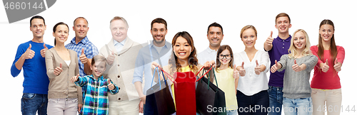 Image of woman with shopping bags and people show thumbs up