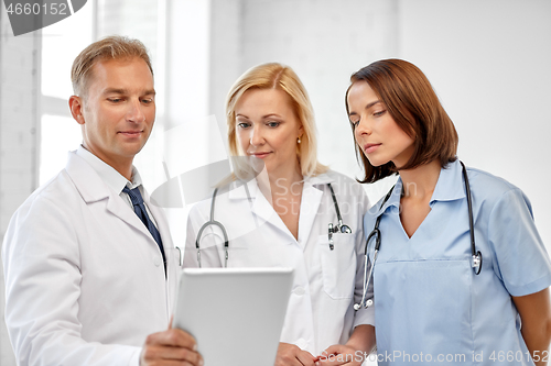 Image of group of doctors with tablet computer at hospital