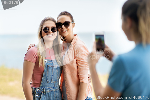 Image of teenage girls or best friends being photographed