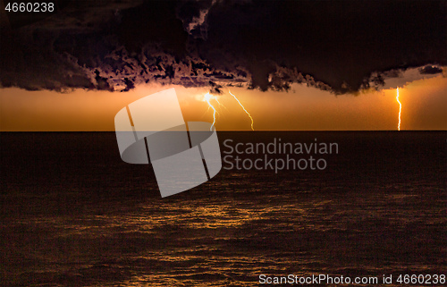 Image of Storm over the ocean with lightning